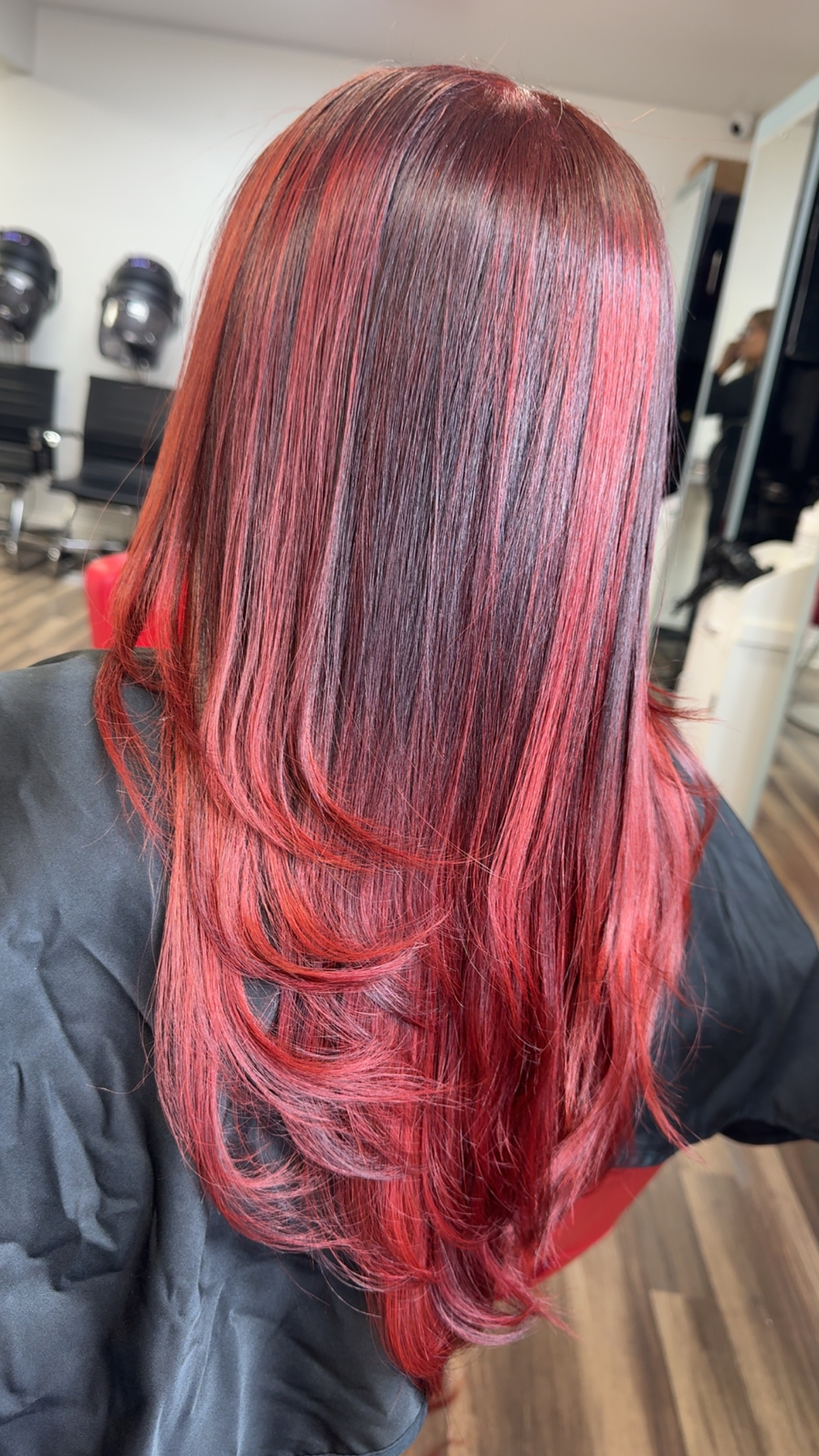 Long red hair color transformation at Hair Bar Experts